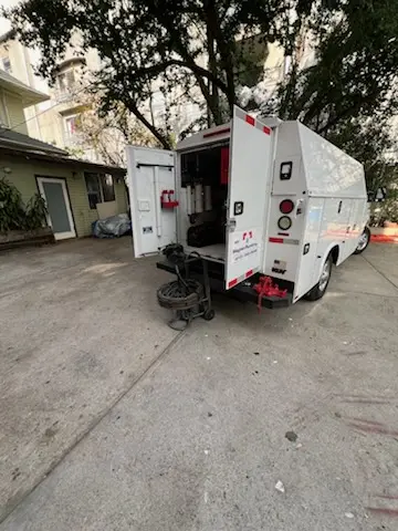 Magnet Plumbing service vehicle on-site for Grease Trap Cleaning in The Woodlands